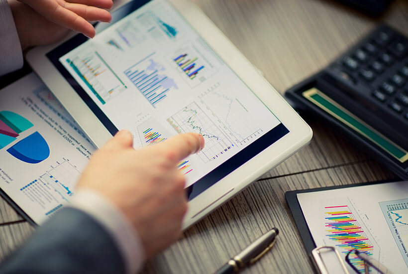 Adviser analysing tax computation charts on a tablet